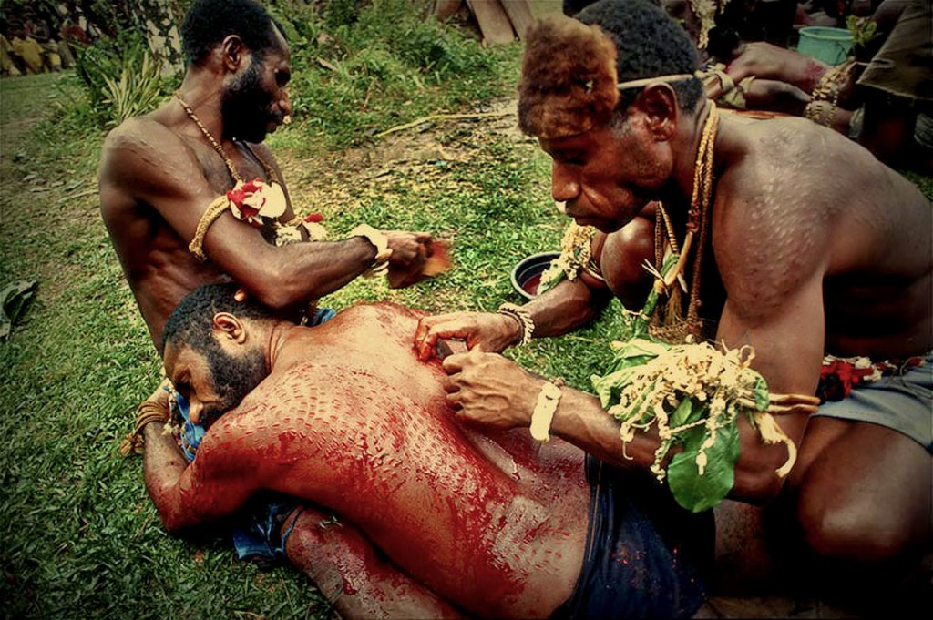 Papua New Guinea&#039;s bloody male initiation rite of scarring boys to look like crocodiles