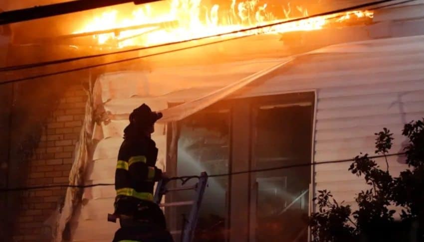 Fast-spreading blaze brings down 3 Bronx homes, leaving 13 firefighters injured