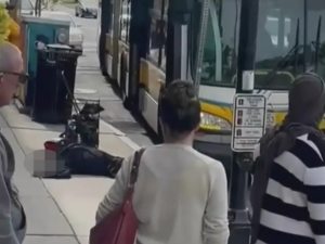 police arrest commuter on Boston bus unhinged crazed woman elderly