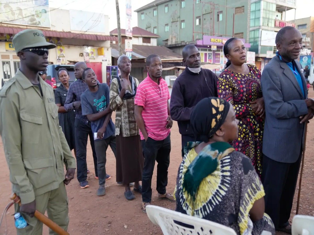 Ugandan voters wait in line to vote.