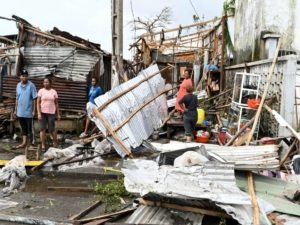 Residents assess the destruction caused by Cyclone Gezina in Toamasina, Madagascar, on Wednesday, Feb. 11, 2026.