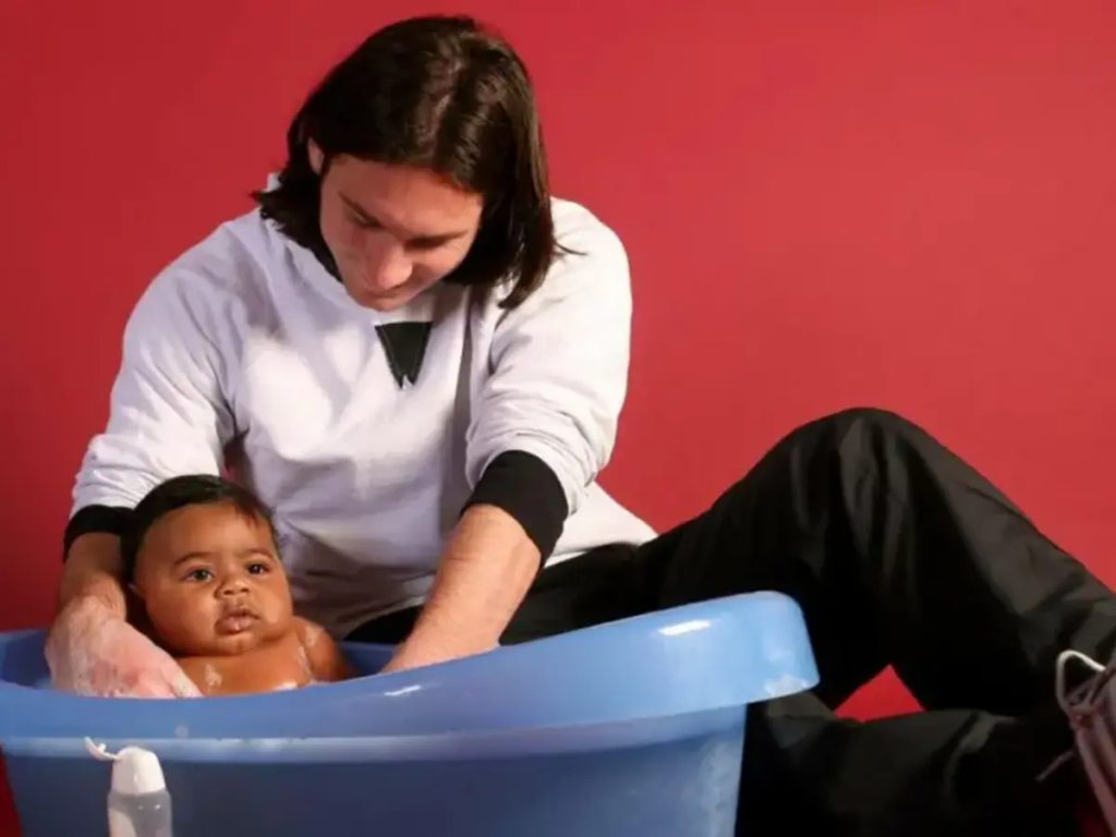 The incredible true story behind the viral image of Messi and baby